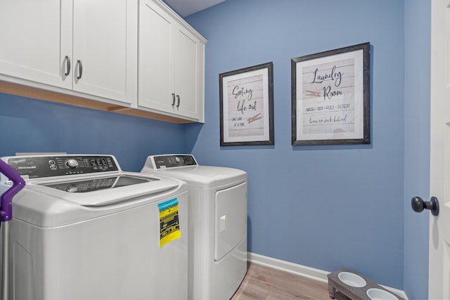 8418 Snowdrop Way, Ooltewah, TN 37363 - washroom featuring baseboards, wood finished floors, cabinet space, and washing machine and dryer