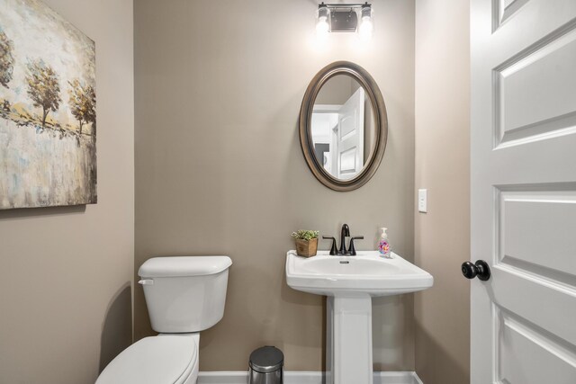 8418 Snowdrop Way, Ooltewah, TN 37363 - bathroom featuring baseboards, toilet, and a sink