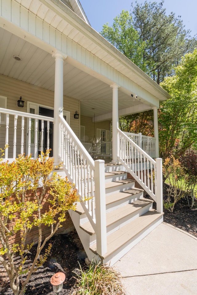 exterior space with a porch and stairs