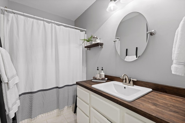 bathroom featuring tile patterned flooring and vanity