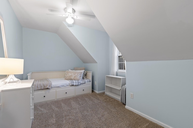 carpeted bedroom with lofted ceiling, ceiling fan, and baseboards