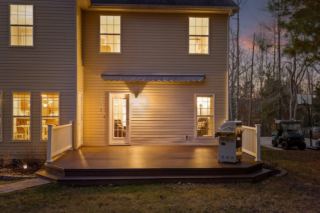 rear view of property with a wooden deck