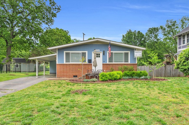 bungalow-style house featuring fence, a front lawn, concrete driveway, and brick siding