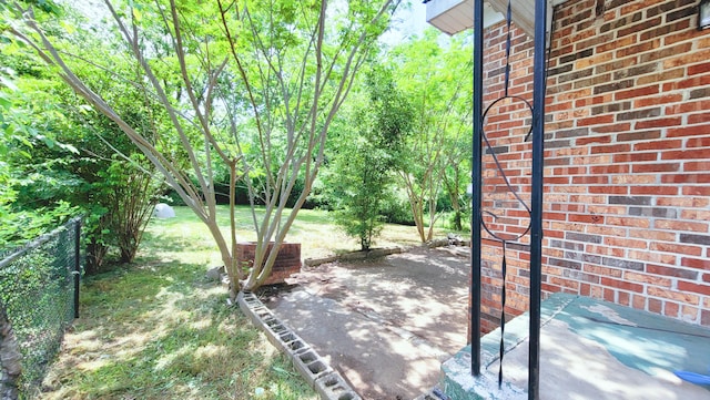 view of yard with fence and a patio area
