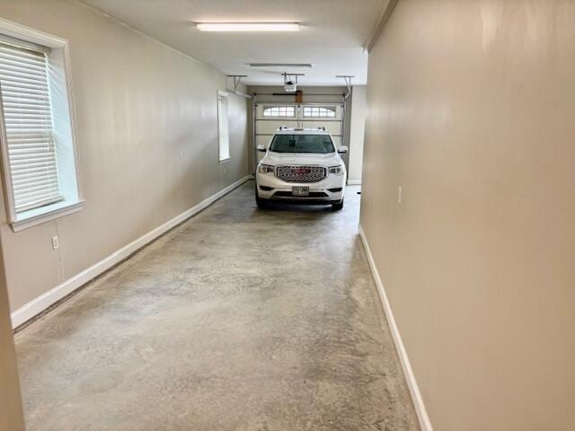 89 Kailors Cove Cir, Ringgold, GA 30736 - garage with baseboards and a garage door opener