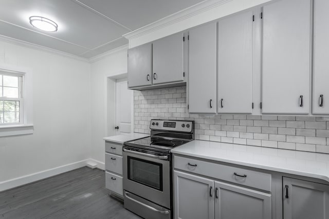 504 1st St, Lafayette, GA 30728 - kitchen with stainless steel electric range, crown molding, baseboards, backsplash, and light countertops