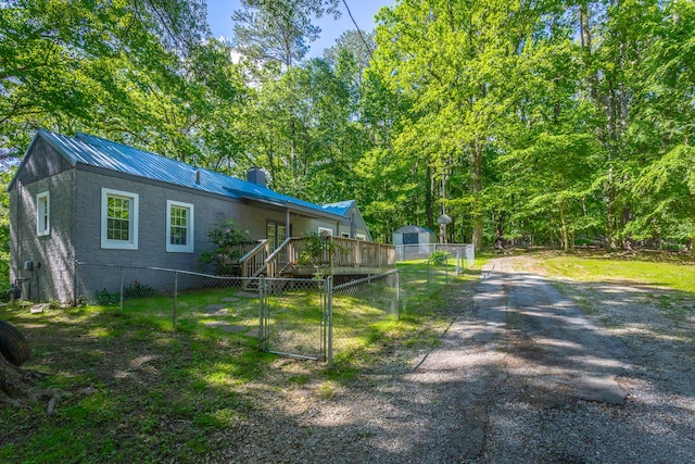 504 1st St, Lafayette, GA 30728 - view of side of home with fence, a gate, a wooden deck, and a chimney