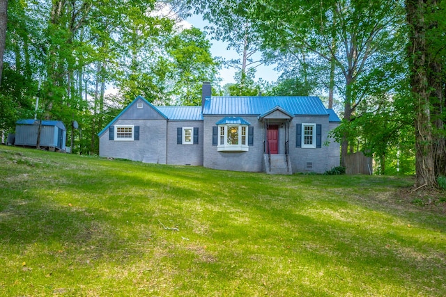504 1st St, Lafayette, GA 30728 - view of front of property featuring a chimney, a front lawn, metal roof, a storage shed, and an outdoor structure