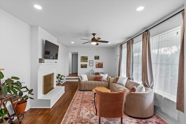 3818 Granada Dr, Chattanooga, TN 37411 - living area with wood finished floors, a ceiling fan, recessed lighting, a brick fireplace, and baseboards