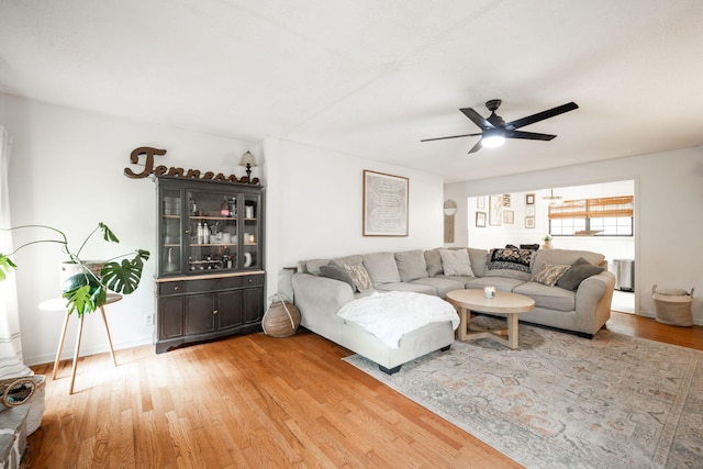 living area featuring ceiling fan and light wood-type flooring