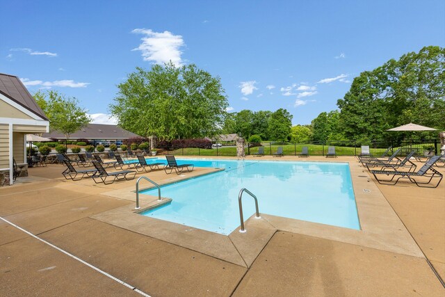 9240 Shay Cv, Ooltewah, TN 37363 - community pool with a patio area and fence