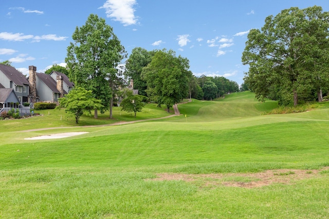 9240 Shay Cv, Ooltewah, TN 37363 - surrounding community with golf course view and a lawn