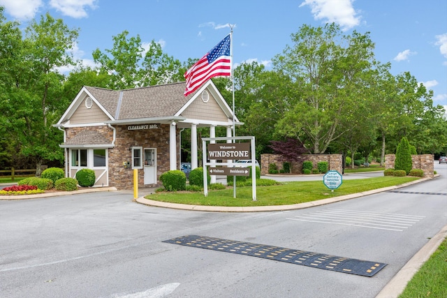9240 Shay Cv, Ooltewah, TN 37363 - view of asphalt road featuring curbs and view of wooded area