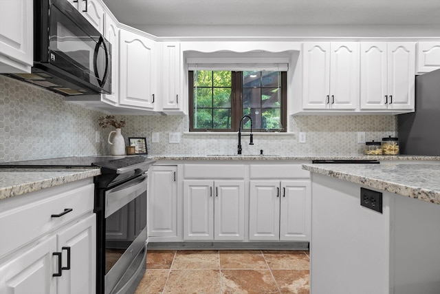 9240 Shay Cv, Ooltewah, TN 37363 - kitchen featuring stainless steel range with electric stovetop, a sink, black microwave, backsplash, and white cabinets