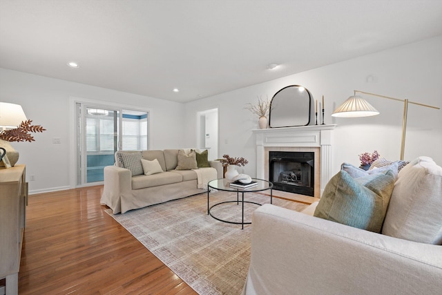 9240 Shay Cv, Ooltewah, TN 37363 - living room featuring wood finished floors, a tile fireplace, baseboards, and recessed lighting