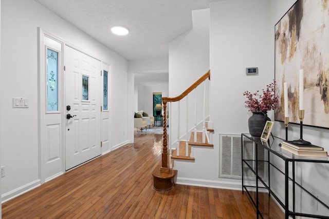 9240 Shay Cv, Ooltewah, TN 37363 - entryway featuring stairs, hardwood / wood-style flooring, and baseboards