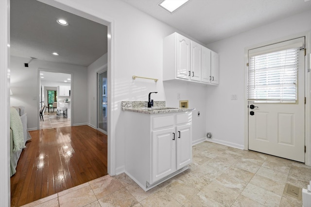 9240 Shay Cv, Ooltewah, TN 37363 - laundry area featuring electric dryer hookup, washer hookup, baseboards, cabinet space, and recessed lighting