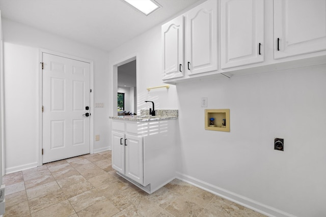 9240 Shay Cv, Ooltewah, TN 37363 - laundry area featuring electric dryer hookup, washer hookup, baseboards, and cabinet space