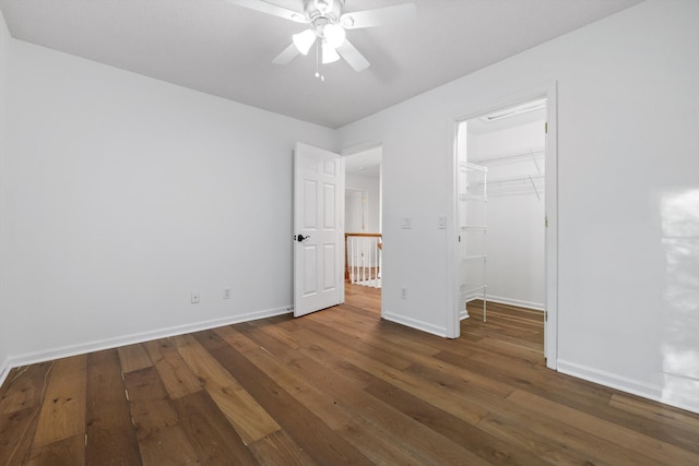 9240 Shay Cv, Ooltewah, TN 37363 - unfurnished bedroom featuring hardwood / wood-style flooring, baseboards, a spacious closet, a closet, and a ceiling fan