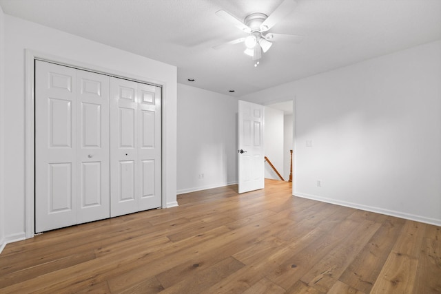 9240 Shay Cv, Ooltewah, TN 37363 - unfurnished bedroom featuring light wood-style flooring, baseboards, a closet, and a ceiling fan