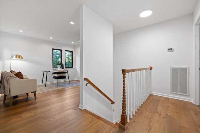 9240 Shay Cv, Ooltewah, TN 37363 - hall with an upstairs landing, hardwood / wood-style flooring, recessed lighting, and baseboards