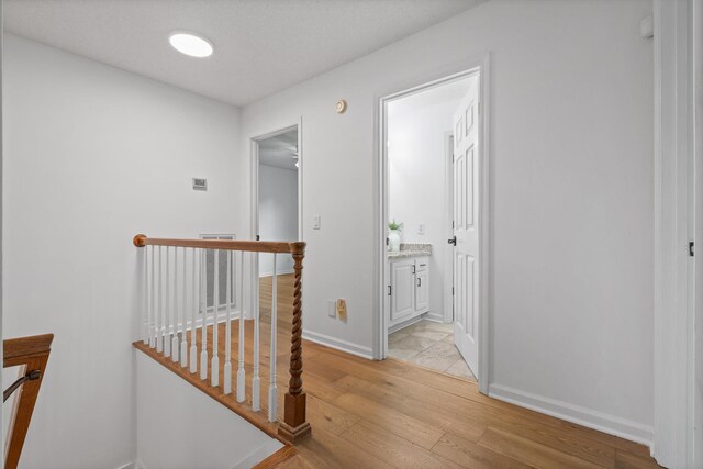 9240 Shay Cv, Ooltewah, TN 37363 - hall featuring light wood-type flooring and baseboards