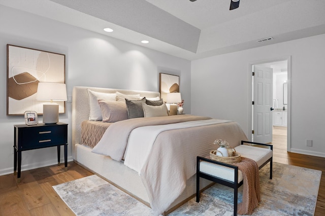 9240 Shay Cv, Ooltewah, TN 37363 - bedroom with wood finished floors, baseboards, a tray ceiling, recessed lighting, and ceiling fan