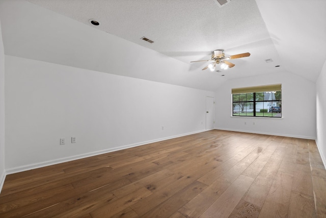 9240 Shay Cv, Ooltewah, TN 37363 - unfurnished room featuring lofted ceiling, ceiling fan, hardwood / wood-style flooring, baseboards, and a textured ceiling