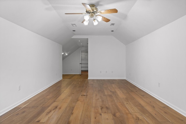 9240 Shay Cv, Ooltewah, TN 37363 - additional living space with hardwood / wood-style floors, ceiling fan, lofted ceiling, and baseboards