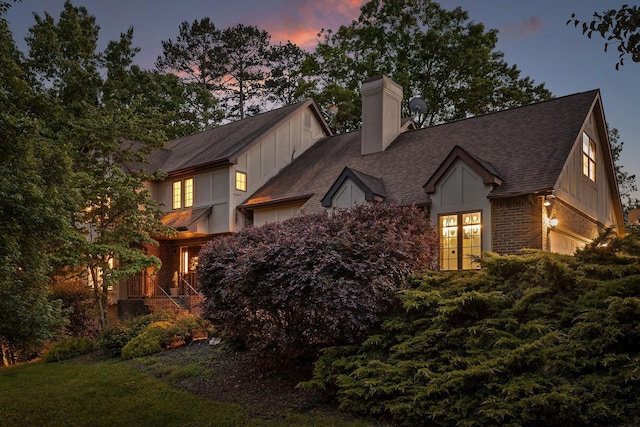 9240 Shay Cv, Ooltewah, TN 37363 - view of front of property with board and batten siding, a chimney, and roof with shingles