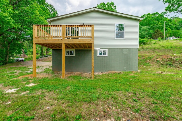 back of house featuring a wooden deck