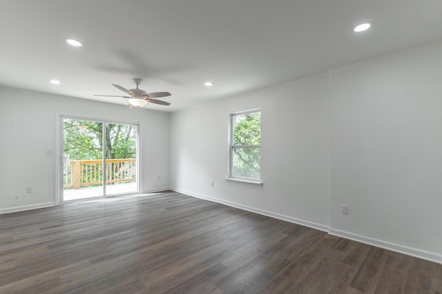 unfurnished room with dark wood-type flooring, a ceiling fan, a healthy amount of sunlight, and recessed lighting