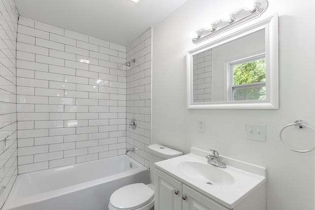 bathroom with toilet, vanity, and shower / bath combination