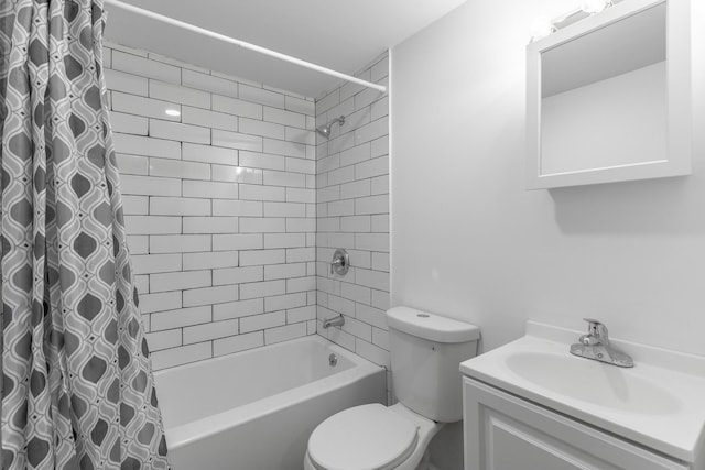bathroom featuring vanity, toilet, and shower / bath combo with shower curtain
