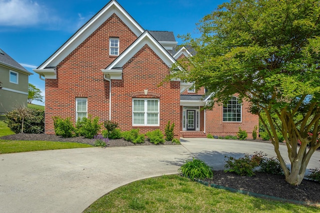 traditional-style house with brick siding
