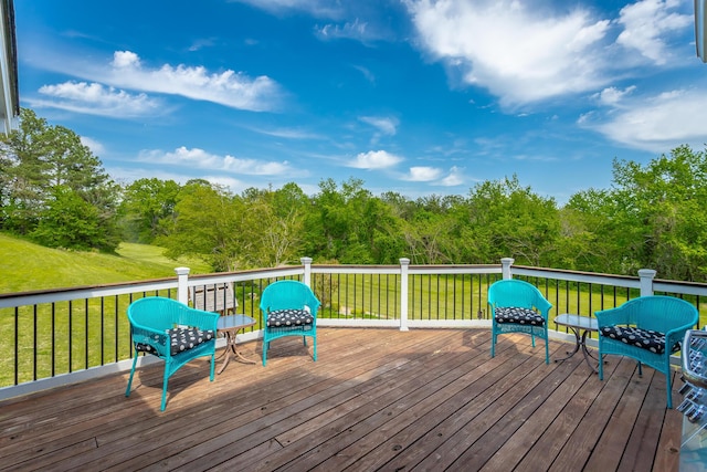 deck featuring a lawn