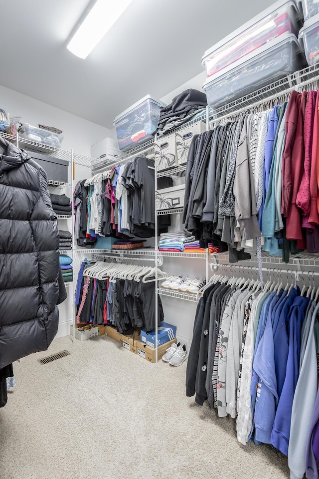 walk in closet with carpet flooring and visible vents