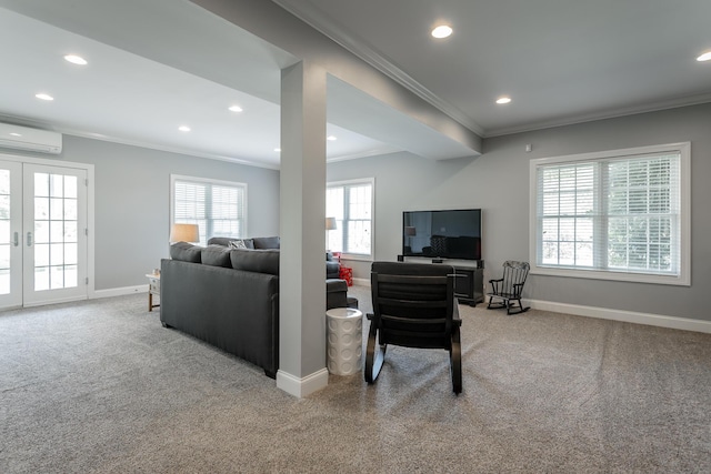 carpeted living area with french doors, recessed lighting, baseboards, a wall unit AC, and ornamental molding