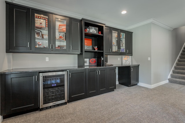 bar featuring bar, crown molding, stairway, wine cooler, and light carpet