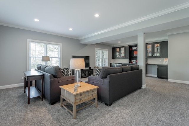 living room with crown molding, recessed lighting, baseboards, and indoor bar
