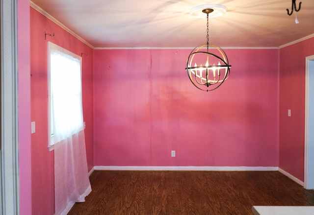 unfurnished dining area with crown molding, baseboards, an inviting chandelier, and wood finished floors