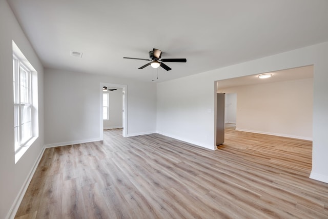 378 Warren St, Rossville, GA 30741 - unfurnished room with light wood finished floors, visible vents, baseboards, and ceiling fan