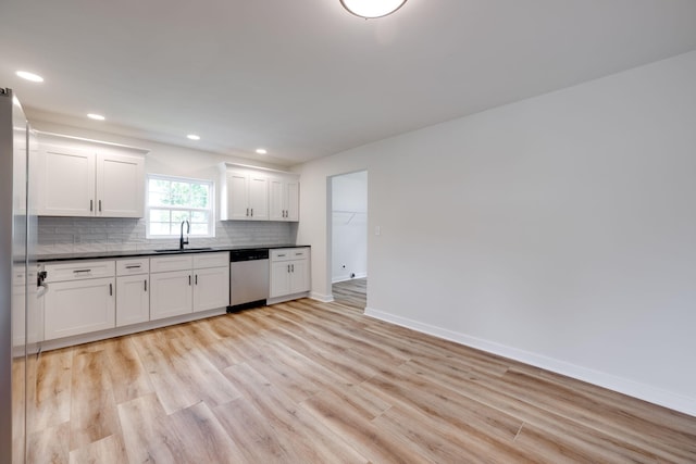 378 Warren St, Rossville, GA 30741 - kitchen with a sink, light wood-type flooring, dishwasher, decorative backsplash, and dark countertops