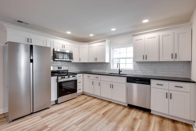 378 Warren St, Rossville, GA 30741 - kitchen featuring dark countertops, stainless steel appliances, visible vents, and a sink