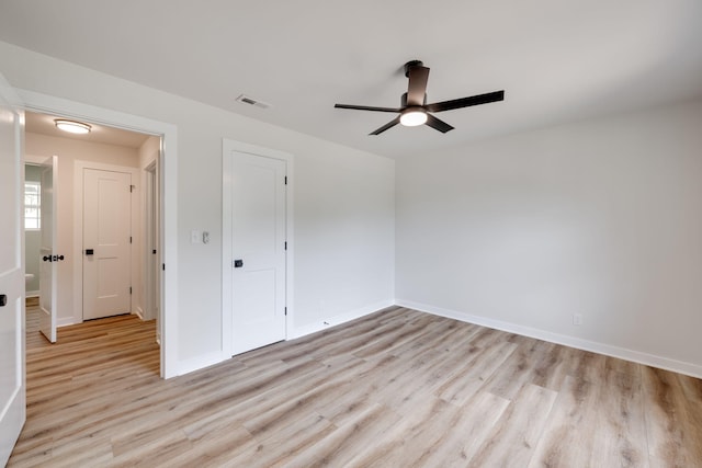 378 Warren St, Rossville, GA 30741 - unfurnished bedroom featuring a ceiling fan, baseboards, light wood-type flooring, and visible vents