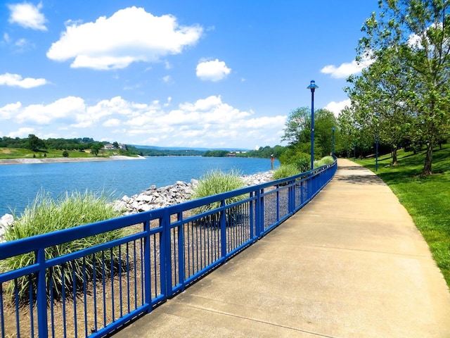 surrounding community featuring a water view