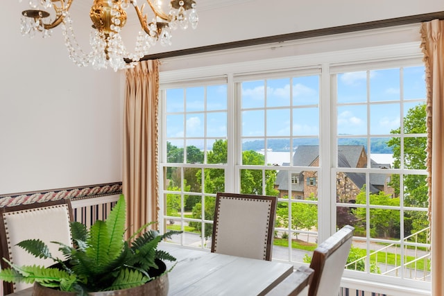 interior space with a water view and an inviting chandelier