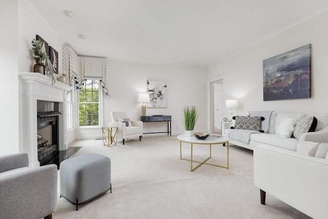 carpeted living area with a fireplace, crown molding, and baseboards