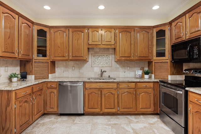 kitchen featuring a sink, ornamental molding, brown cabinets, and appliances with stainless steel finishes