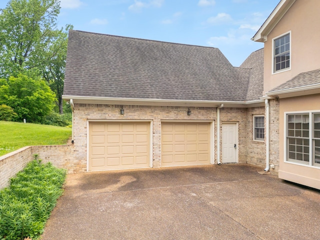 garage featuring driveway